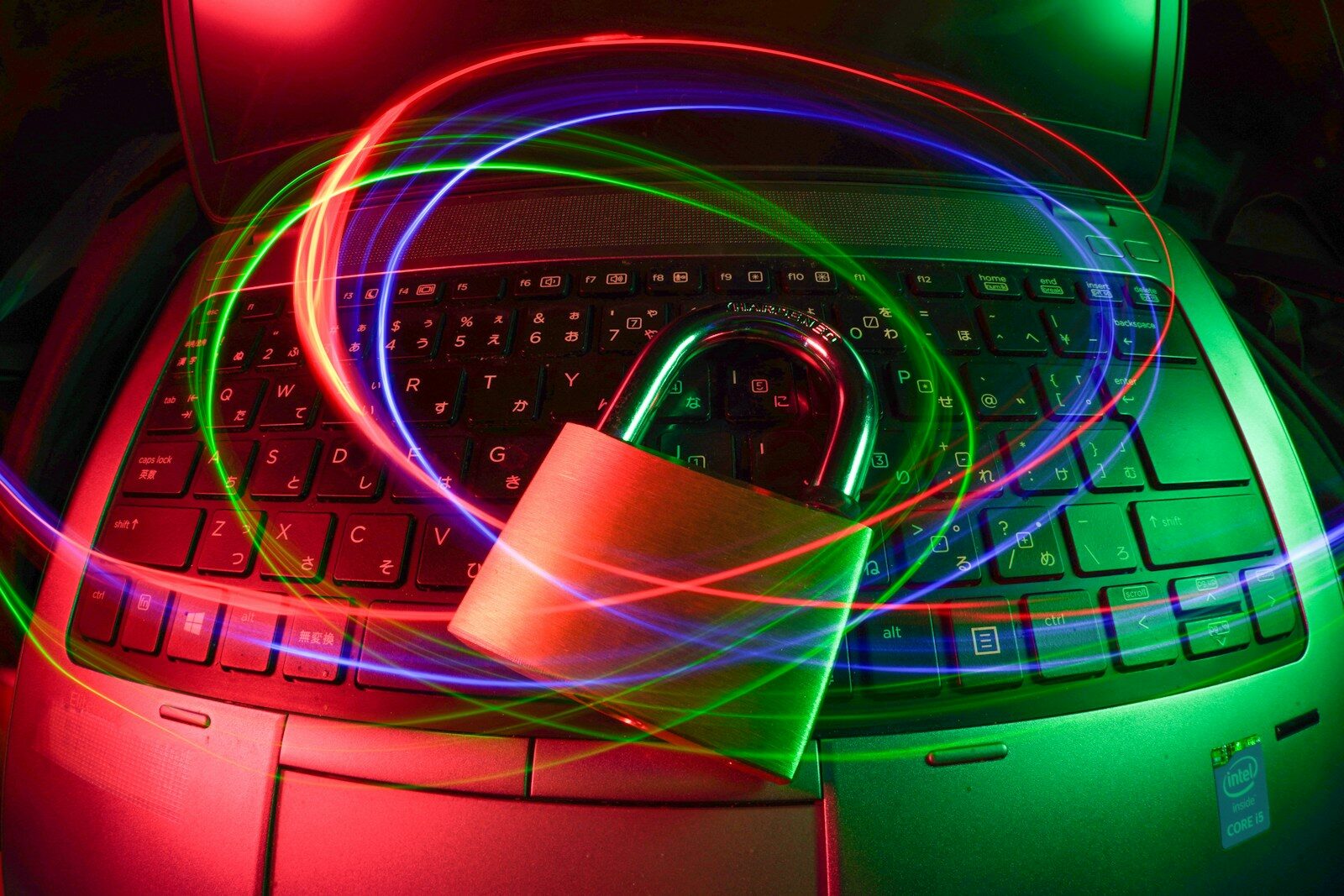 A padlock icon overlaid on a laptop, representing digital security