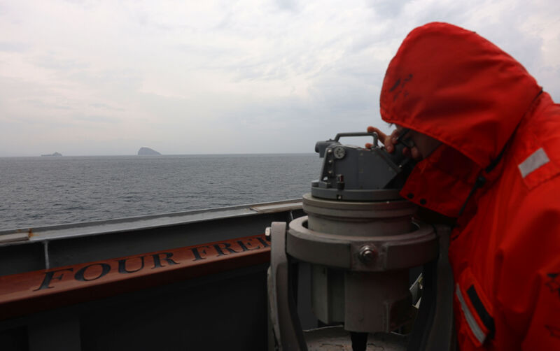 A US Navy guided-missile destroyer under way in the Strait of Hormuz.