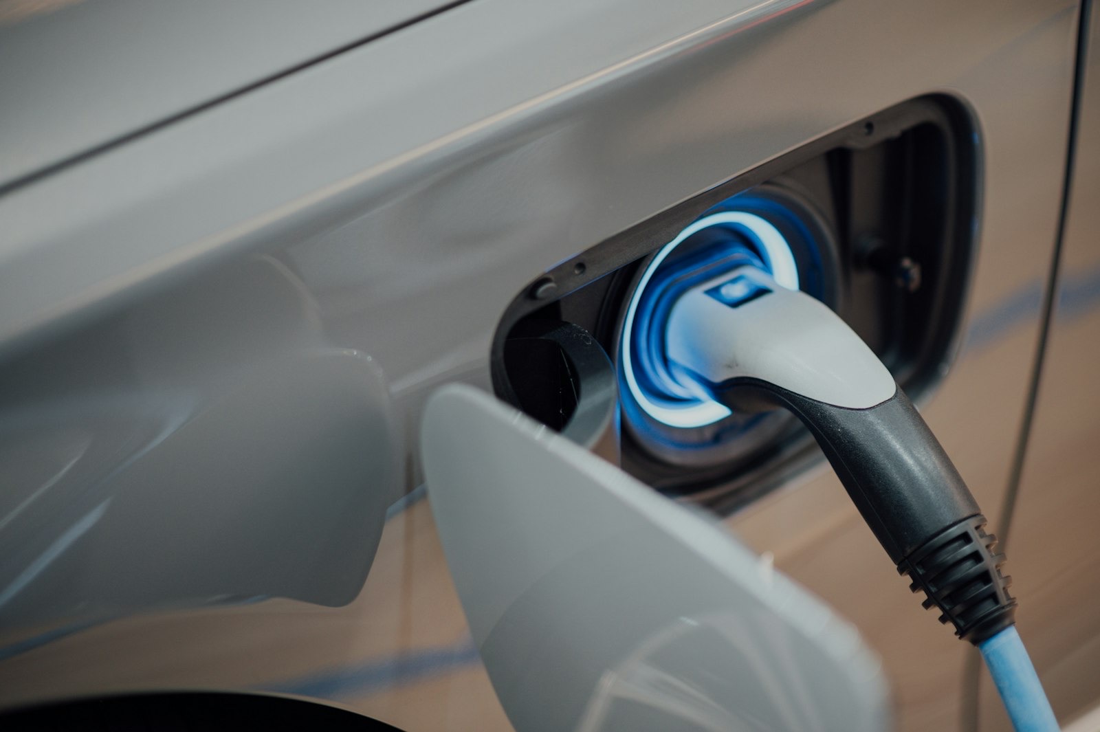 An electric vehicle charging at a public station