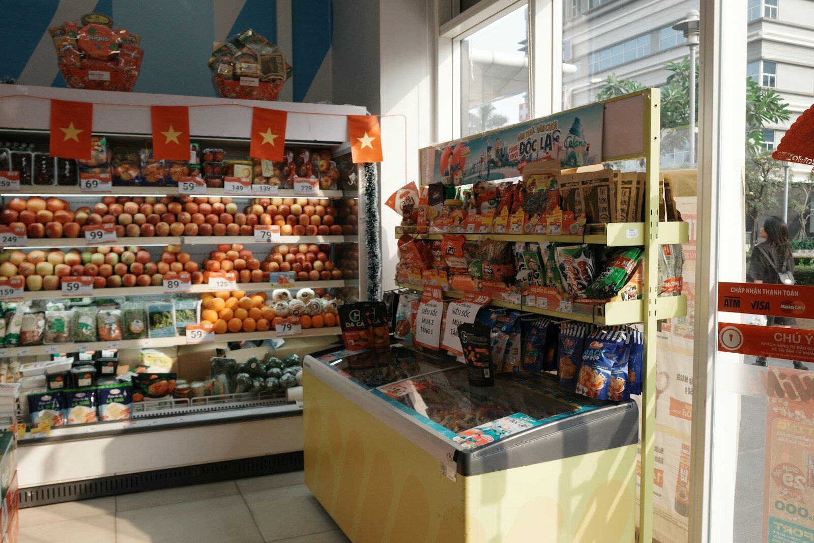 A grocery store aisle stocked with fresh produce