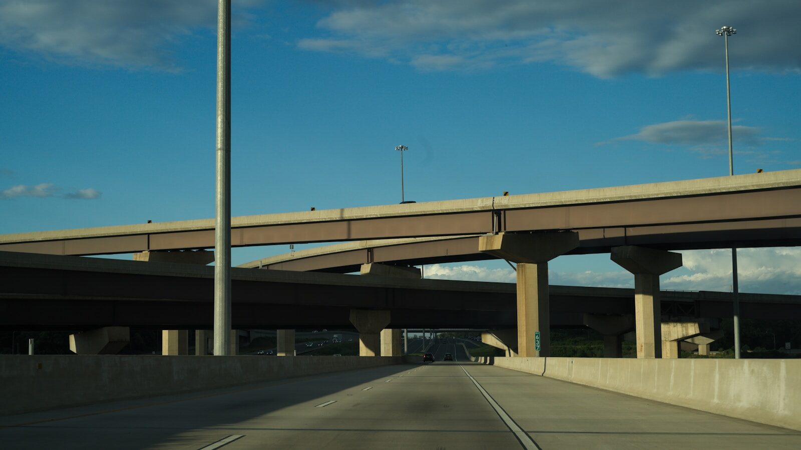 A concrete highway flyover carrying traffic overhead