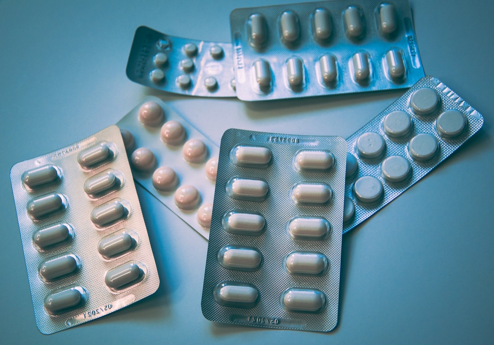 Prescription medication bottles on a white surface
