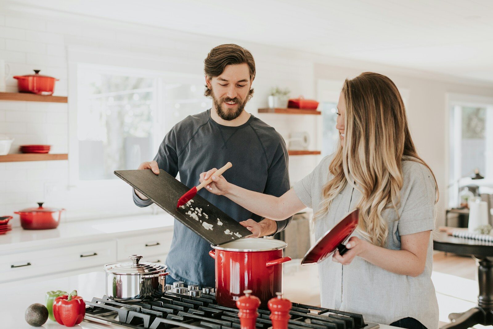 Two family members cooking together in a home kitchen