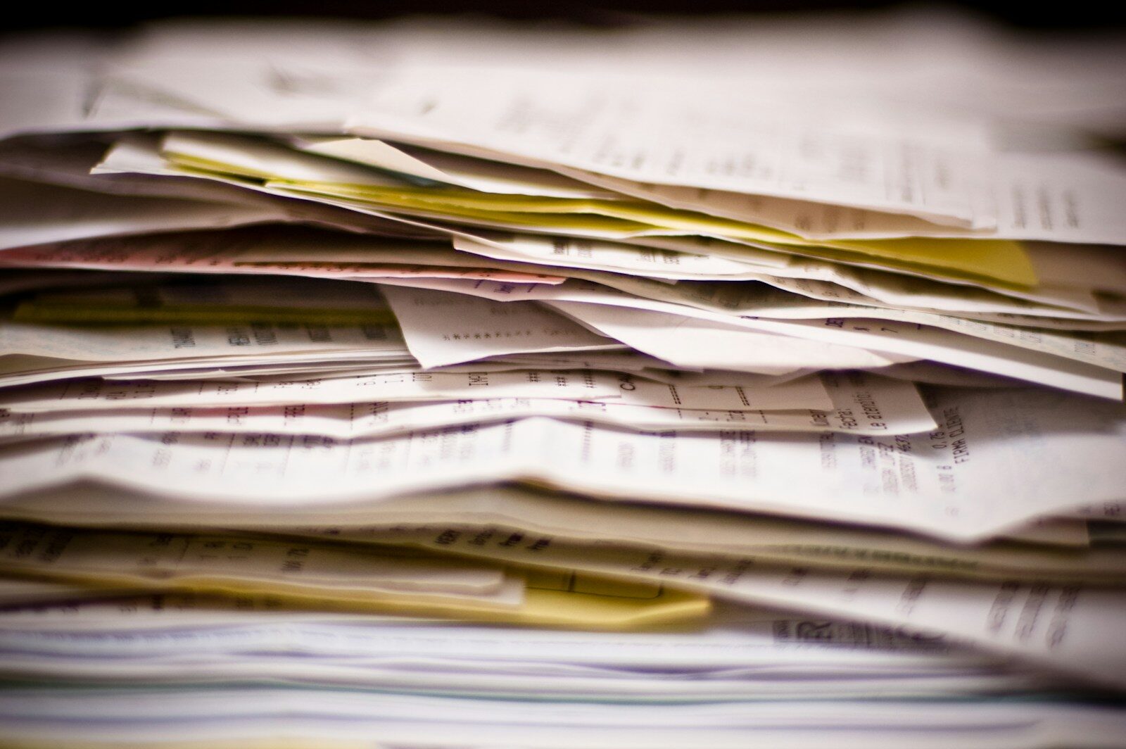 A dense stack of medical billing paperwork
