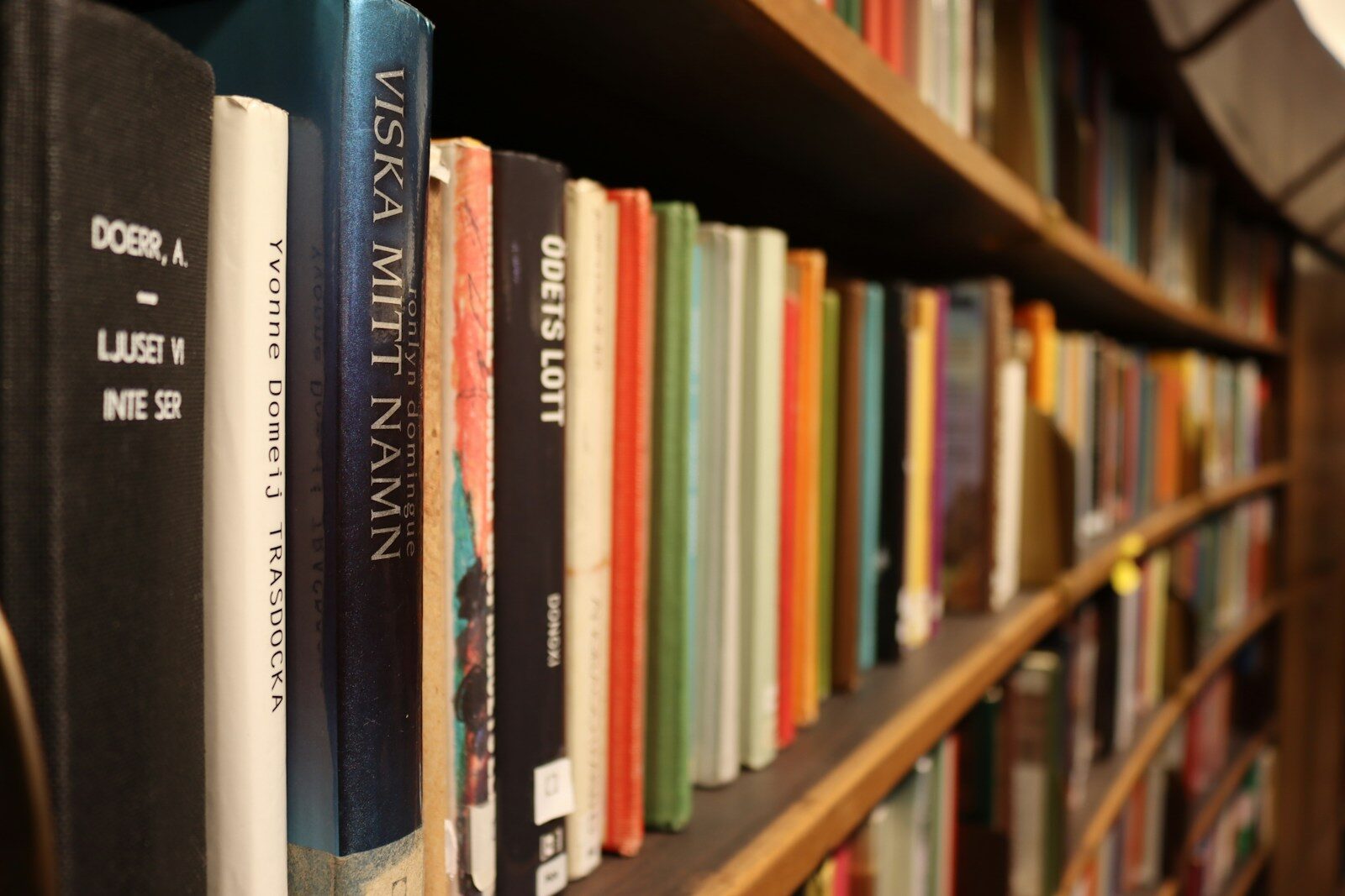 Shelves of brightly coloured books in a public library