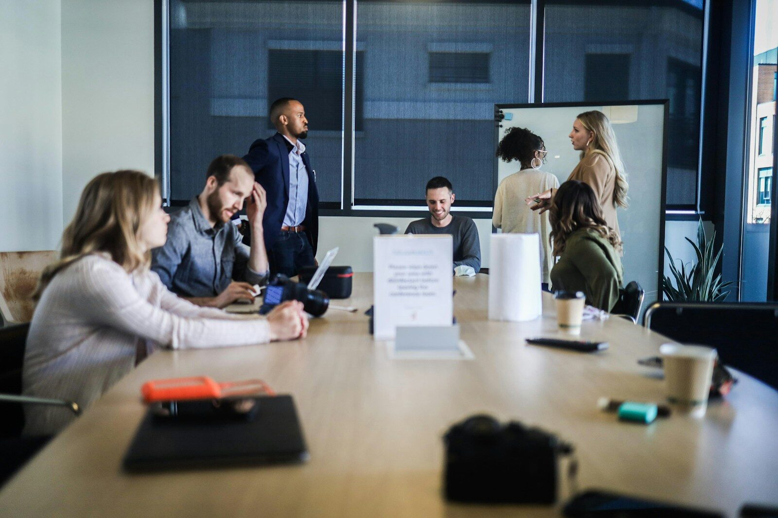 A team seated around a table in a working meeting