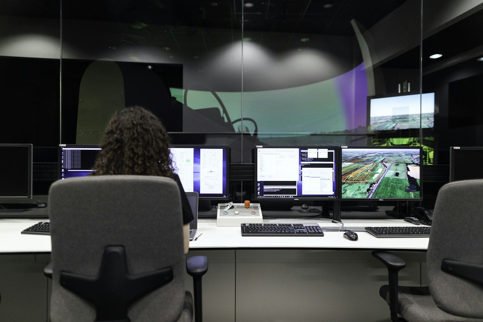 An engineer monitoring readings across dual screens