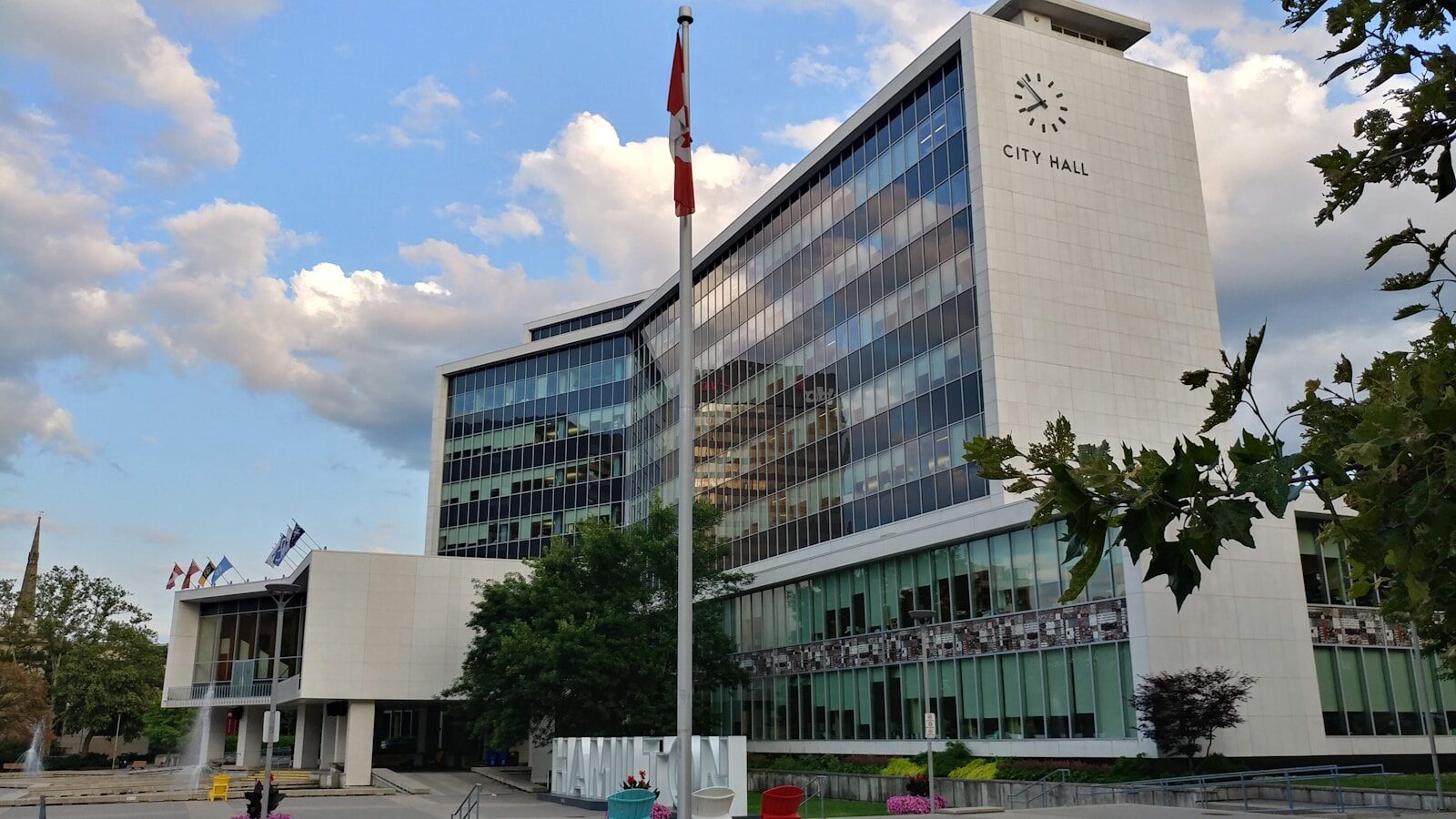 A municipal building with a flagpole standing in front of it