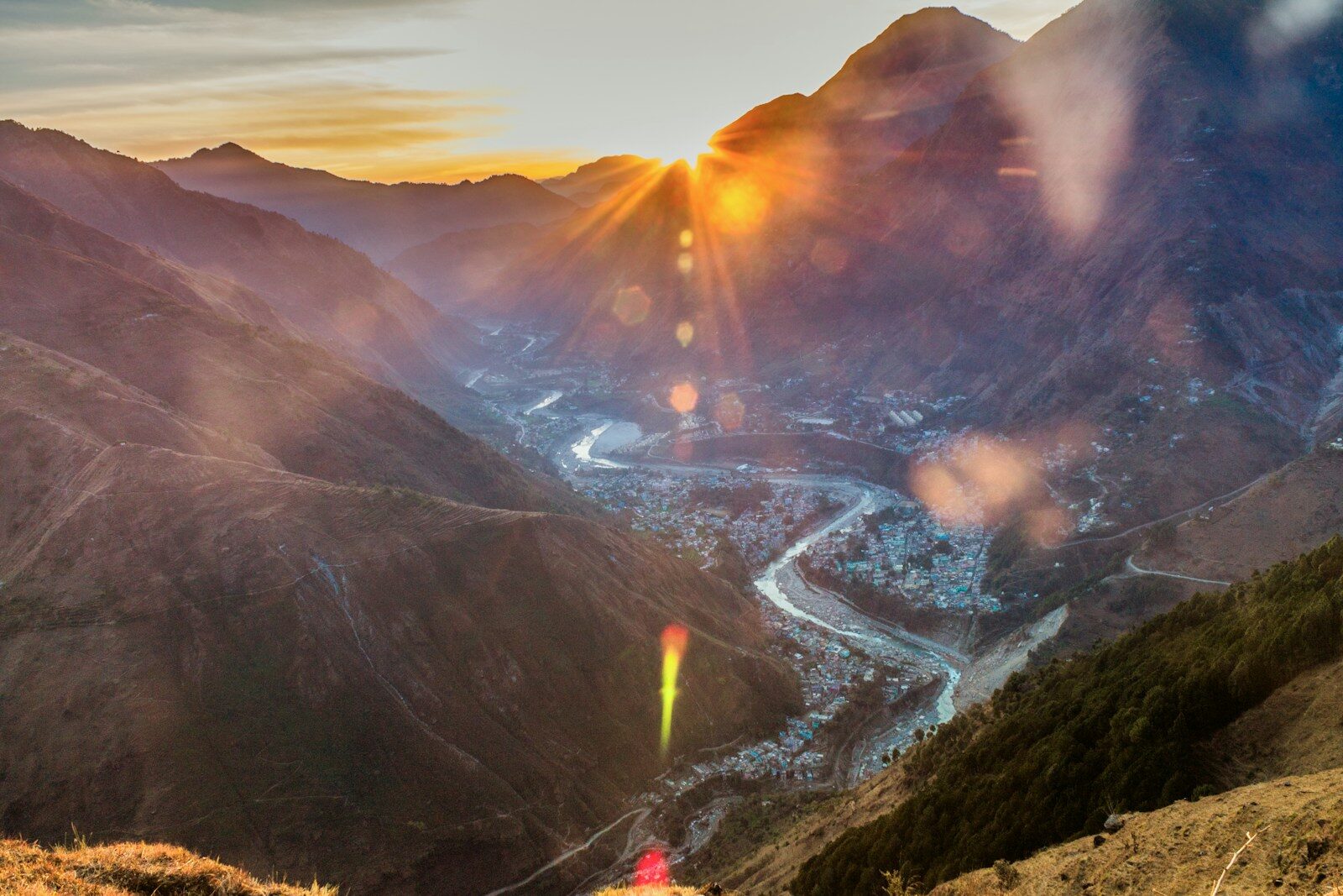 A Himalayan river running through a steep valley past a town in Darchula, far-western Nepal.