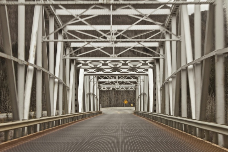 The steel understructure of a large bridge.