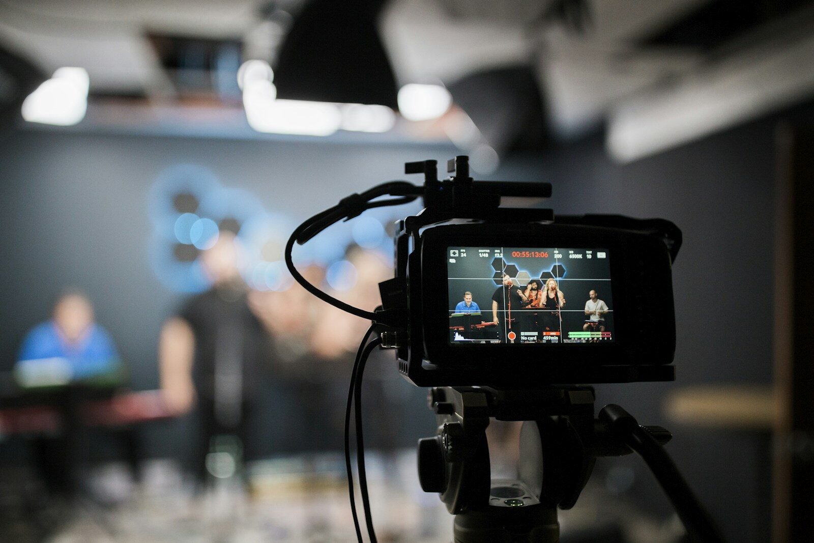 A DSLR camera mounted and recording, the whole kit of a one-person newsroom