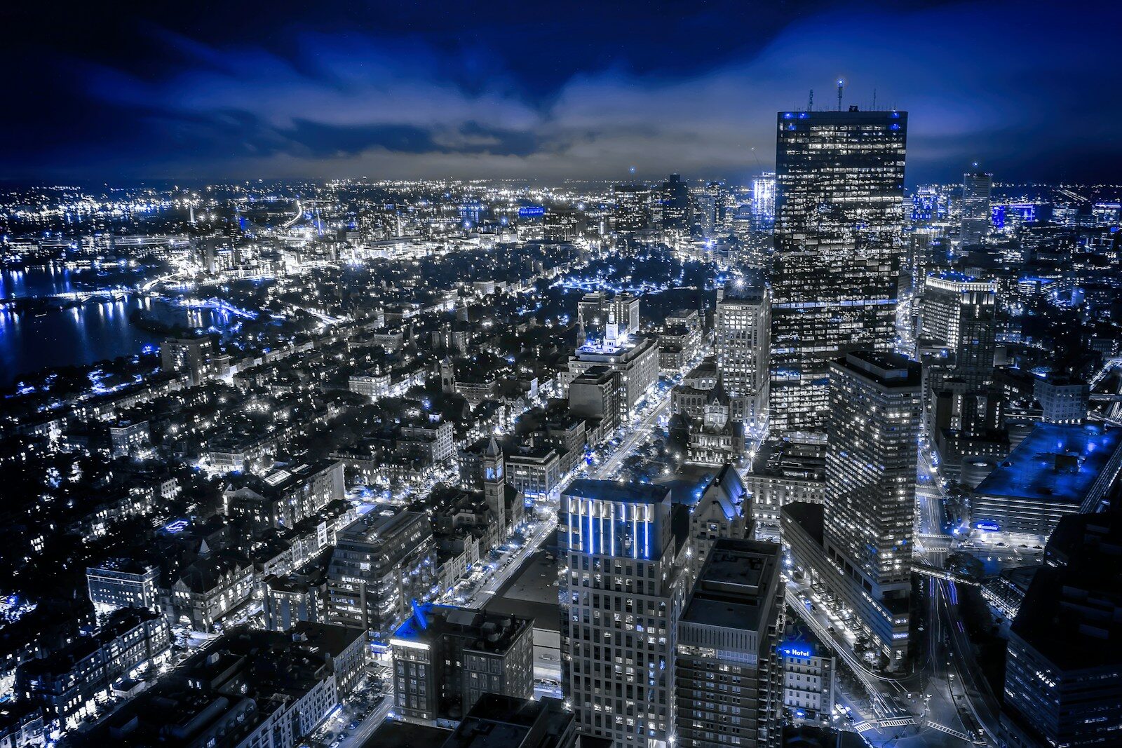 An aerial view of a financial district skyline at night