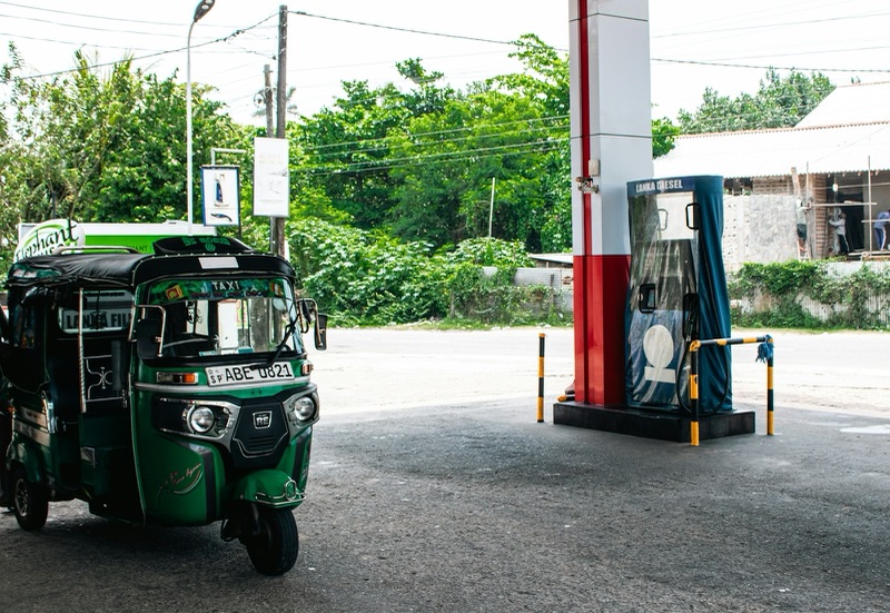 A fuel pump nozzle at a petrol station.
