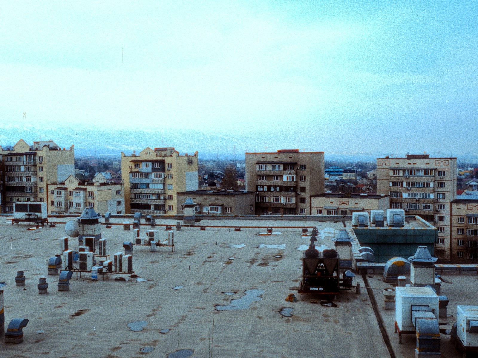 Rooftop view of apartment buildings and hvac units