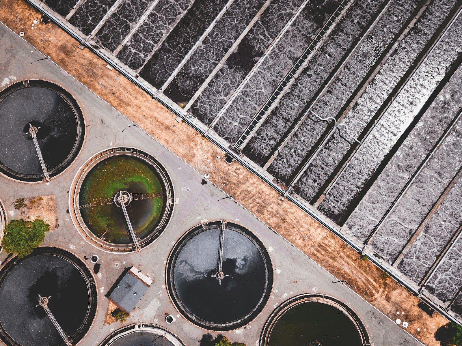 Concrete treatment tanks at a water plant seen from above