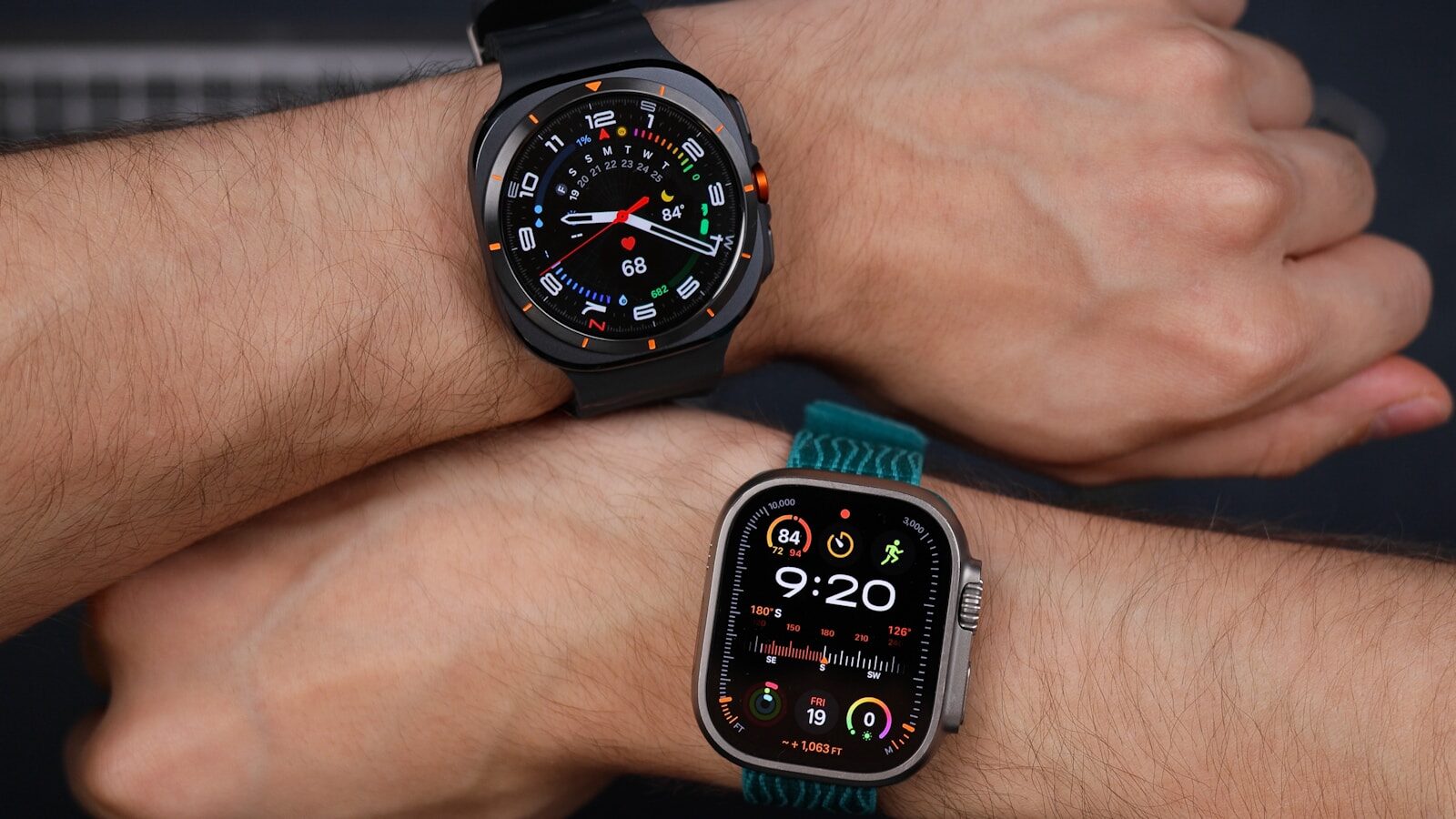 Two people comparing smartwatches on their wrists