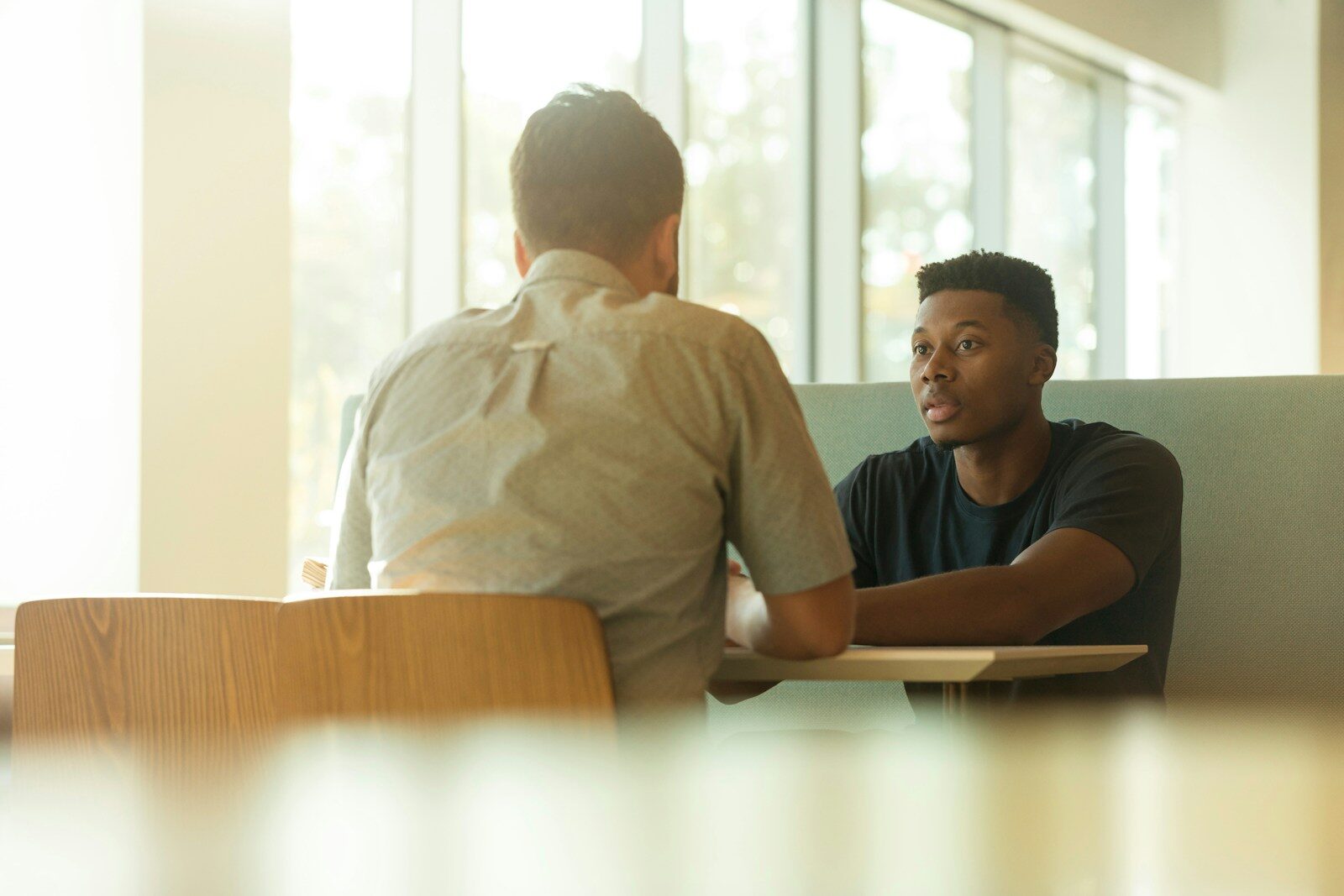Two colleagues in conversation during a workplace counselling session